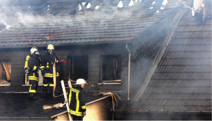 Firefighters putting out house fire